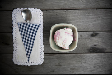 Berry ice cream on wood background