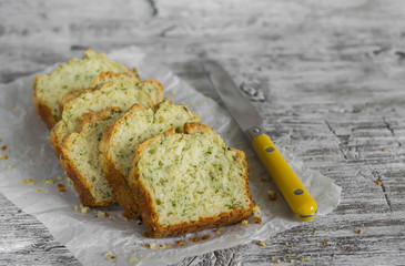 cake with cheese and herbs on a light wooden background