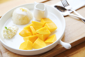 Sticky Rice with Mango on wood background