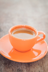 Hot coffee on wooden table