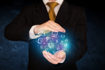 holding hand drawn media icons