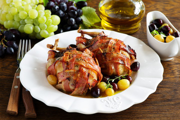 Baked stuffed quail with grape sauce.