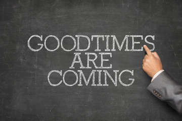 Good times are coming text on blackboard