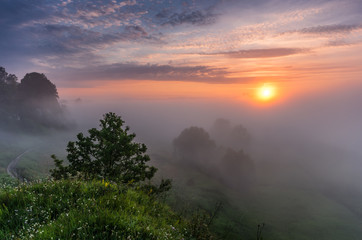 Sunrise over Vistula river valley covered with the mornings mists near Krakow, Poland