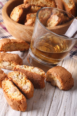 Italian almond biscotti cookies and wine close-up. vertical
