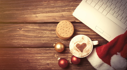 White laptop computer and Santas