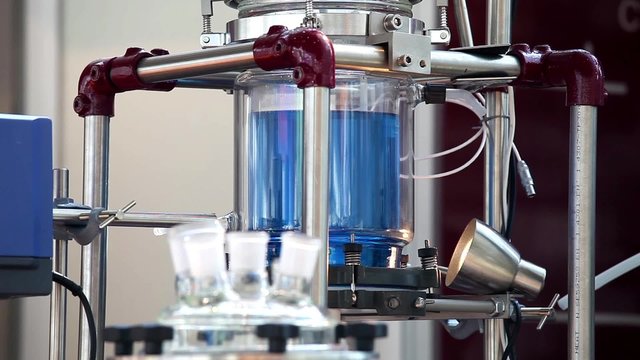 Close up of  process in lab reactor. Lab reactors are used for optimizing and reproducing chemical reaction, mixing, dispersing, and homogenization processes.