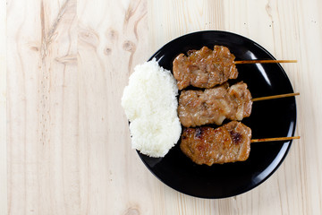 Thai-styled grilled pork and sticky rice. It's among most popular street foods in Thailand.