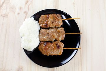 Thai-styled grilled pork and sticky rice. It's among most popular street foods in Thailand.
