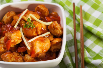 Fried chicken pieces in batter with sweet and sour sauce