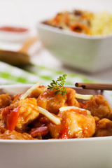 Fried chicken pieces in batter with sweet and sour sauce