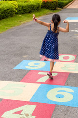 Girl Playing Hopscotch / Girl Playing Hopscotch on Playground