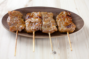 Thai-styled grilled pork. It's among most popular street foods in Thailand.