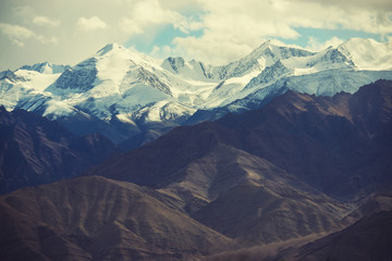 Scenic view of snow mountain mange take from Leh city , Ladakh ,India. Filter : cross processed vintage tone.