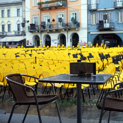 View of the Locarno square with a lot of yellow chairs for the Locarno Film Festival