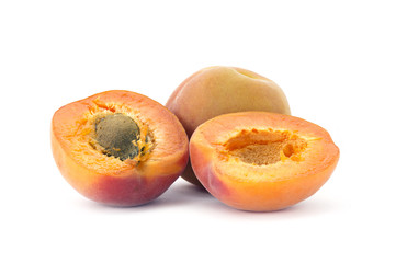 half an d whole apricots, isolated on white