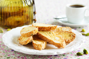 Italian cookies (biscotti) with almonds and pistachios. Selective focus.