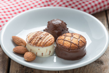 Chocolate candy In White Dish, Close up.