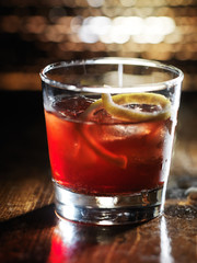 sazerac cocktail on dark wooden background