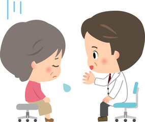 元気がない高齢女性と励ます医師