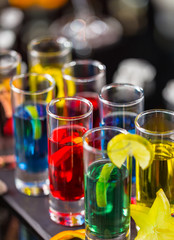 Colored alcoholic shots on bar counter