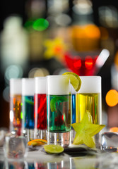 Colored alcoholic shots on bar counter