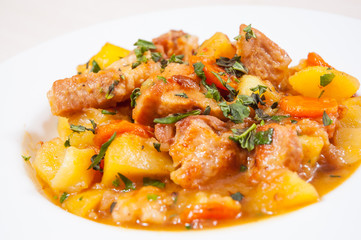 stewed meat with potatoes, onion and carrot