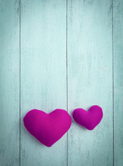 Abstract background of Pink hearts on wood background
