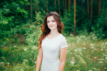 Portrait Of a Smiling Young Happy Beauty Red Hair Girl In White 