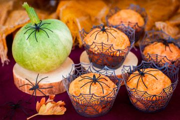 Halloween Pumpkin Muffins Decorated with Spiders and Spider Web