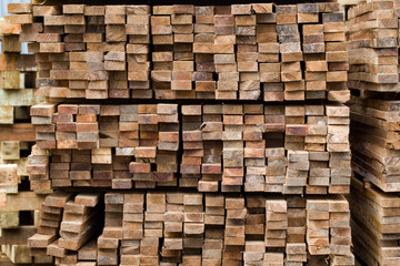 Pile of stacked rough cut lumber
