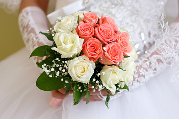 The bride at a wedding holding a bouquet of flowers.