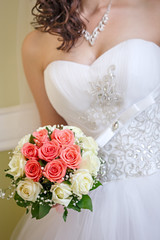 The bride at a wedding holding a bouquet of flowers.
