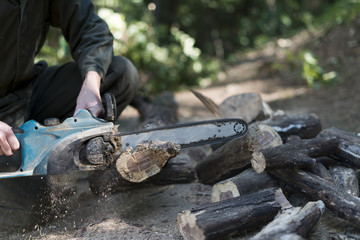 Wood cutting with Chainsaw