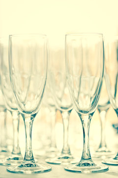 Glasses for drinks and cocktails at the festive table. toned