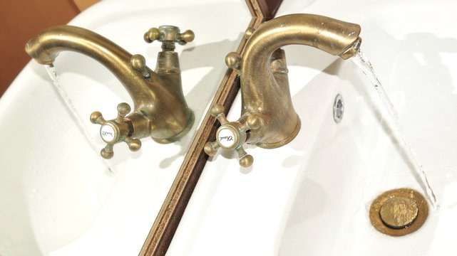 Close up of vintage tap and toiletries
