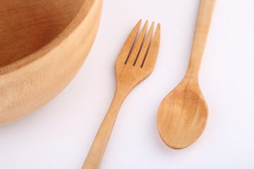 wooden fork and wooden spoon with wooden bowl  isolated on white