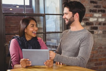  couple looking at the tablet