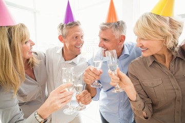 Casual business people making birthday toasts