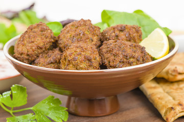 Falafel - Middle Eastern deep fried balls made of chickpeas.
