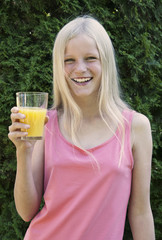 Funny girl with a glass of juice
