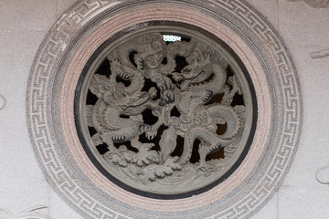 Chinese dragons carved on stone wall