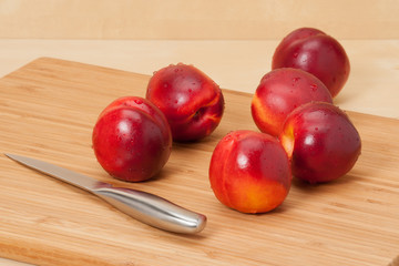 Fresh Nectarine Fruits On Wooden Board
