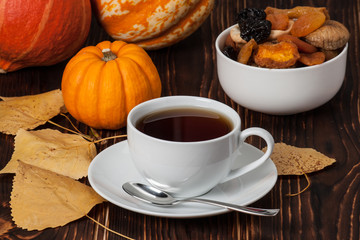 Obraz na płótnie Canvas Autumn Concept. Cup Of Tea Or Coffee. Dried Fruits. Pumpkins. Wo
