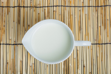 Cow milk and ceramic jug