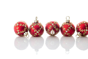 Red Christmas balls on white