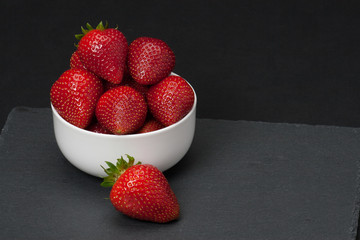 Fresh Strawberries In A Bowl. Natural Slate Placemat