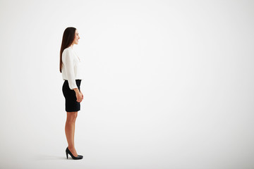 smiley businesswoman over light grey background