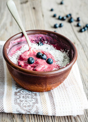 banana ice cream with blueberries and coconut, teaspoon