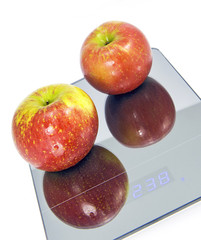 Red Apples and Scale for a Weighing Machine